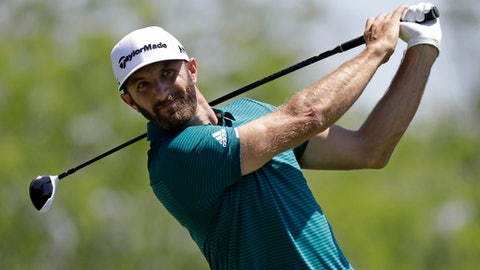 Dustin Johnson tees off on the fifth hole during the second round of the Memorial golf tournament Friday