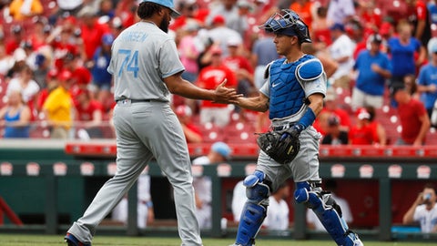 Los Angeles Dodgers relief pitcher Kenley Jansen and third baseman Logan Forsythe right celebrate after closing the ninth inning of a baseball game against the Cincinnati Reds Sunday