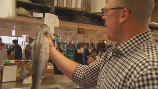 Marlins pay a visit to Seattle's world famous fish market
