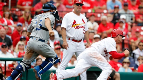 Struggling Cardinals shuffle coaching staff, cut Peralta