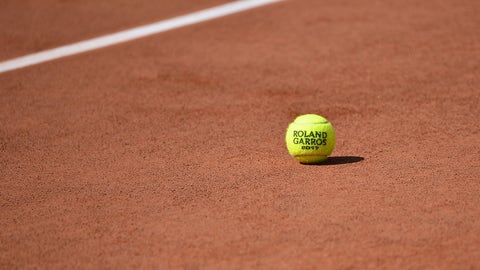 PARIS, FRANCE - MAY 23:  A general view of a Roland Garros tennis ball on the clay before the start of the 2017 French Open at Roland Garros on May 23, 2017 in Paris, France.  (Photo by Aurelien Meunier/Getty Images)