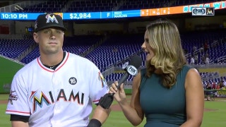 Tyler Moore faces the inevitable pie from the clubhouse monkey after the win over the Reds