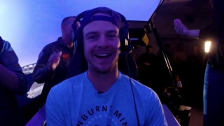 Wil Myers takes a ride in an F-18 simulator