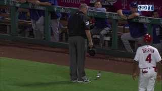 Jeff Banister helps an injured bird off the field