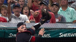 Cleveland's Roberto Perez makes a great foul-ball catch against the net