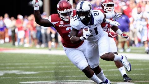 TCU running back Kyle Hicks is tackled by Arkansas defender Mc Telvin Agim as he runs the ball in the first half of an NCAA college football game in Fayetteville Ark. Saturday Sept. 9 2017
