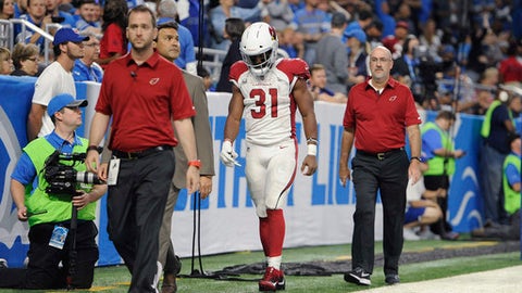 Arizona Cardinals running back David Johnson walks off the field with medical staff for X-rays during an NFL football game against the Detroit Lions in Detroit Sunday Sept. 10 2017