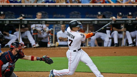 Miami Marlins' Giancarlo Stanton hits a home run during the fourth inning of a baseball game against the Atlanta Braves Thursday Sept. 28 2017 in Miami
