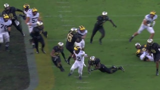 Michigan's Chris Evans scores on a 49-yd touchdown run to seal the Wolverines' 38-10 win