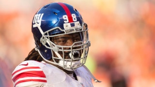 Giants DT Damon "Snacks" Harrison spends recovery time with his son