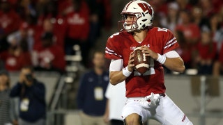 The Wisconsin Badgers storm back to rout the Utah State Aggies 59-10