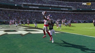 Odell Beckham Jr. miraculously hangs on to bobbled ball for a TD, then raises his fist in the air