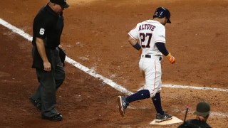 Jose Altuve hits a home run in the fifth inning for the Houston Astros