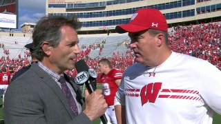 Bruce Feldman chats with Wisconsin head coach Paul Chryst, after the Badgers' dominant win
