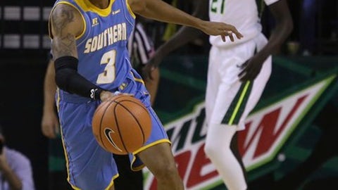 Southern University guard Eddie Reese (3) brings the ball up as Baylor forward Nuni Omot (21) watches during the first half of an NCAA college basketball game Wednesday, Dec. 20, 2017, in Waco, Texas. (AP Photo/Jerry Larson)