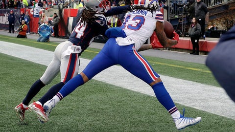 Buffalo Bills wide receiver Kelvin Benjamin can't make a catch in the end zone in front of New England Patriots cornerback Stephon Gilmore left during the first half of an NFL football game Sunday Dec. 24 2017 in Foxborough Mass. (AP Phot