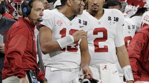 Alabama's Jalen Hurts is seen on the bench with Tua Tagovailoa head coach Nick Saban during the second half of the NCAA college football playoff championship game against Georgia Monday Jan. 8 2018 in Atlanta