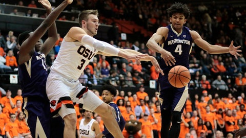Washington's Matisse Thybulle defends as Oregon State's Tres Tinkle passes the ball during the first half of an NCAA college basketball game in Corvallis Ore. Saturday Feb. 10 2018