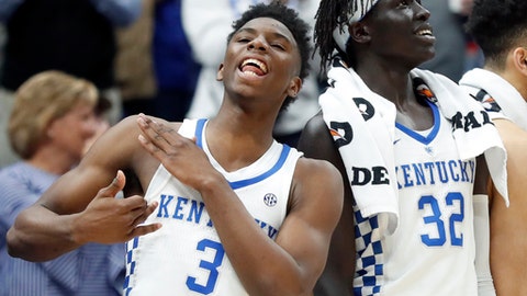 Kentucky's Hamidou Diallo and Wenyen Gabriel celebrate during the second half of an NCAA college basketball game against Alabama in the semifinals of the Southeastern Conference tournament Saturday