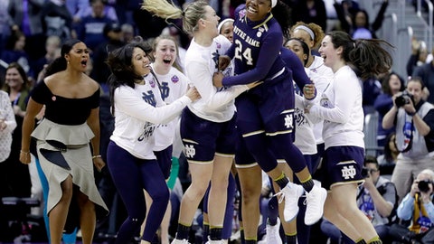 Notre Dame's Arike Ogunbowale celebrates after making the game-winning basket to defeat Connecticut in overtime in the semifinals of the women's NCAA Final Four college basketball tournament Friday