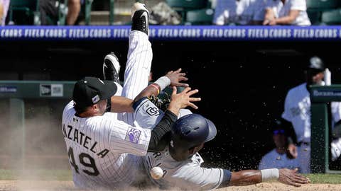 Padres put up 9 in 7th to down Rockies