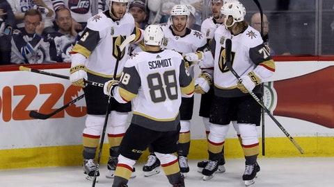 The Vegas Golden Knights' celebrate after Jonathan Marchessault scored on Winnipeg Jets goaltender Connor Hellebuyck not shown during first period game 2 NHL Western Conference Finals hockey action in Winnipeg Manitoba Monday