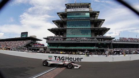 Will Power of Australia crosses the start finish line to win the Indianapolis 500 auto race at Indianapolis Motor Speedway in Indianapolis Sunday
