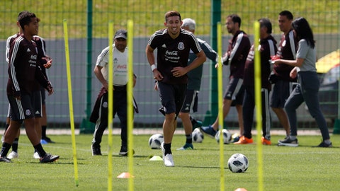 Mexico's Hectro Herrera center trains with his teammates during a training session of Mexico at the 2018 soccer World Cup in Moscow Russia Wednesday