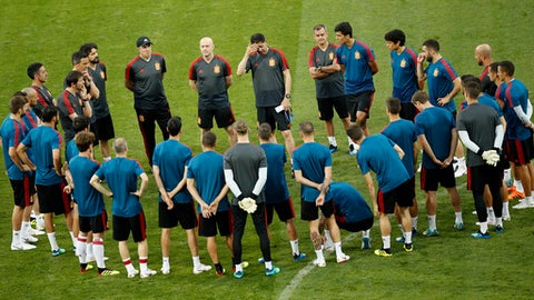 Spain head coach Fernando Hierro top centre touches his forehead as gives instructions to his players during Spain's official training on the eve of the group B match between Portugal and Spain at the 2018 soccer World Cup in the Fisht Stadium in S
