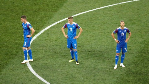 Iceland players react in dejection at the end of the group D match between Nigeria and Iceland at the 2018 soccer World Cup in the Volgograd Arena in Volgograd Russia Friday