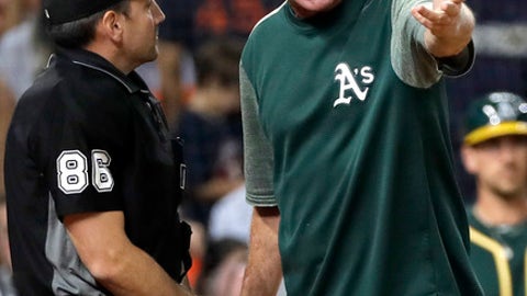 Oakland Athletics manager Bob Melvin argues with home plate umpire David Rackley during the fourth inning of the team's baseball game against the Houston Astros on Tuesday