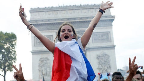 With flags, song, pride, French celebrate unifying victory..