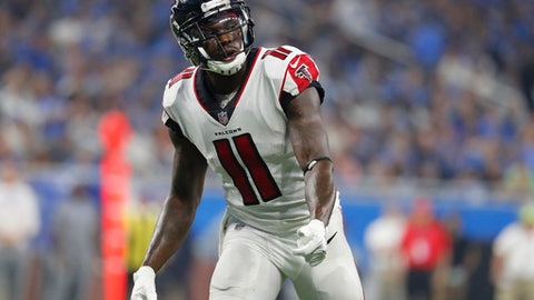 FILE - In this Sept. 24, 2017, file photo, Atlanta Falcons wide receiver Julio Jones waits on the snap during the first half of the team's NFL football game against the Detroit Lions in Detroit. Jones will be in training camp for the Falcons. Less than 24 hours before players are required to report, general manager Thomas Dimitroff said the two sides reached an agreement to renegotiate Jones contract in 2019. That was apparently good enough to get a commitment from the star receiver to be in camp by Thursdays 4 p.m. deadline. (AP Photo/Paul Sancya, File)