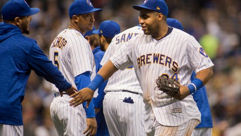 Milwaukee Brewers first baseman Jesus Aguilar right celebrates the Brewers victory over the Detroit Tigers during a baseball game Sunday Sept. 30 2018 in Milwaukee. Brewers defeated the Tigers 11-0