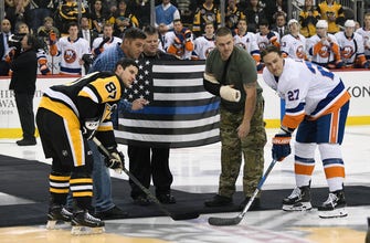 
					Penguins honor shooting victims with ceremony, special logo
				