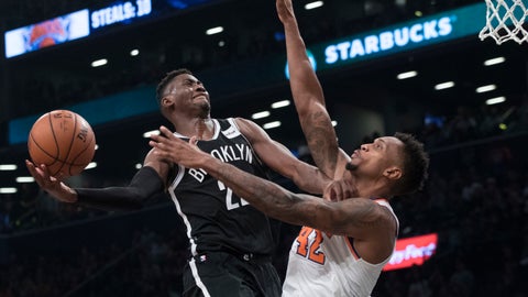 Brooklyn Nets guard Caris Le Vert goes to the basket against New York Knicks forward Lance Thomas during the second half of an NBA basketball game Friday Oct. 19 2018 in New York