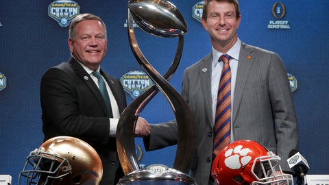 Notre Dame head coach Brian Kelly left and Clemson head coach Dabo Swinney share a moment during the NCAA Cotton Bowl football coaches' news conference in Dallas Friday Dec. 28 2018. Notre Dame is scheduled to play Clemson in the