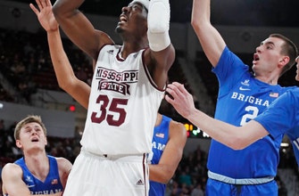 
					Aric Holman leads No. 19 Mississippi St over BYU 103-81
				