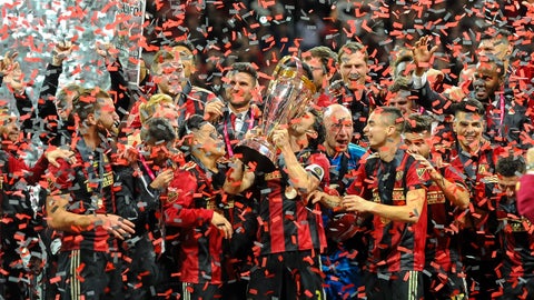 ATLANTA, GA - DECEMBER 08: Atlanta United captain Michael Parkhurst (3)  kisses the Major League Soccer Philip F. Anschutz trophy after the MLS Cup Finals match between Atlanta United and Portland Timbers on December 8, 2018 at Mercedes-Benz Stadium in Atlanta, GA.(Photo by John Adams/Icon Sportswire via Getty Images)