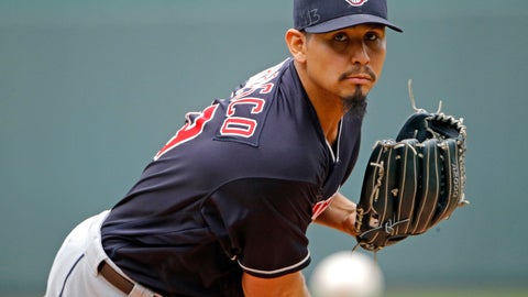 Cleveland Indians starting pitcher Carlos Carrasco throws during the first inning of a baseball game against the Kansas City Royals in Kansas City Mo. The Indians have signed Carrasco to a new