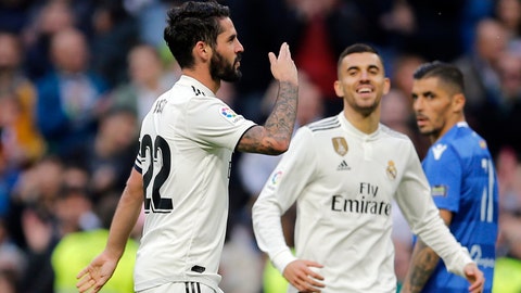 Real Madrid's Isco left celebrates after scoring his side's fourth goal during a round of 32 2nd leg Spanish Copa del Rey soccer match between Real Madrid and Melilla at the Santiago Bernabeu stadium in Madrid Spain Thursday