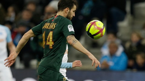 Monaco midfielder Cesc Fabregas challenges for the ball during the League One soccer match between Marseille and Monaco at the Velodrome stadium in Marseille southern France Sunday Jan. 13 2019