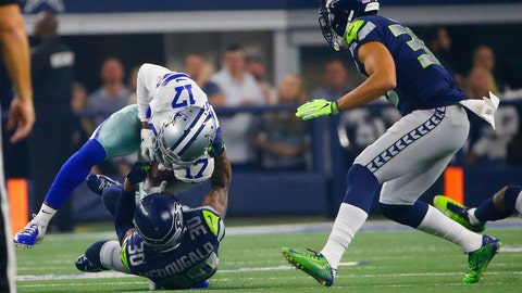 Dallas Cowboys wide receiver Allen Hurns is hit by Seattle Seahawks strong safety Bradley Mc Dougald during the first half of the NFC wild-card NFL football game in Arlington Texas Saturday Jan. 5 2019