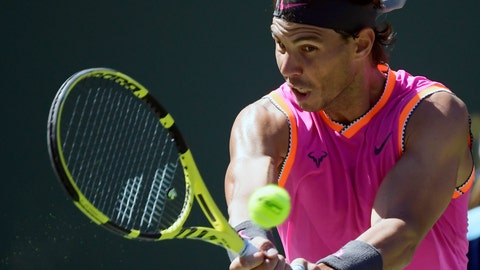 Rafael Nadal of Spain returns a shot to Filip Krajinovic of Serbia at the BNP Paribas Open tennis tournament Wednesday