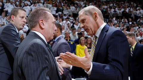 Michigan State coach Tom Izzo left meets with Michigan coach John Beilein before an NCAA college basketball game Saturday