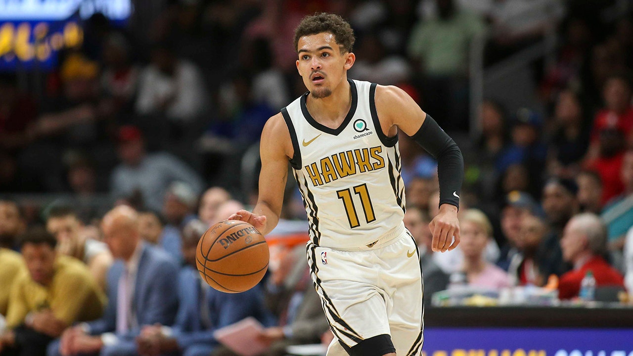 trae young gold jersey