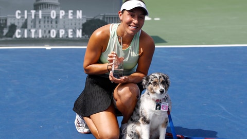 Jessica Pegula poses with a trophy and her dog Maddie after defeating Camila Giorgi of Italy in a final match at the Citi Open tennis tournament Sunday Aug. 4 2019 in Washington