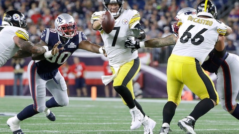 Pittsburgh Steelers quarterback Ben Roethlisberger tries to scramble away from New England Patriots linebacker Shilique Calhoun in the second half of an NFL football game Sunday Sept. 8 2019 in Foxborough Mass. (AP