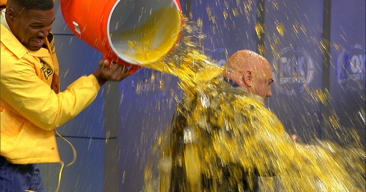 Watch Michael Strahan give Jay Glazer a surprise Gatorade bath on the