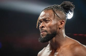 
					WWE Superstars lift up Kofi Kingston after defeat
				